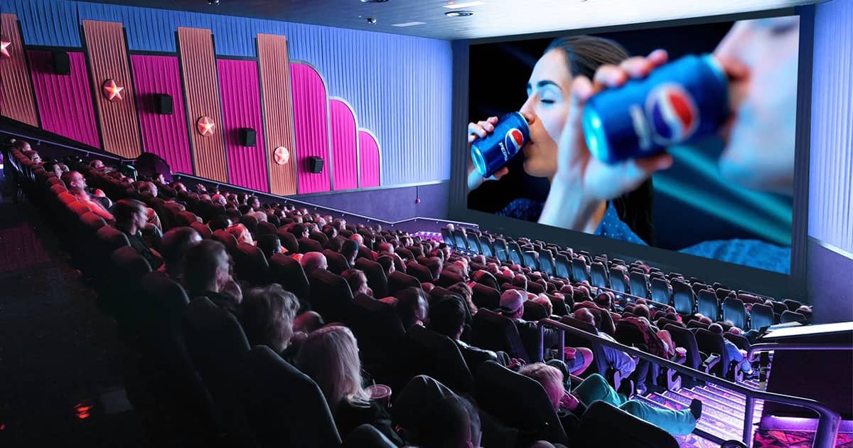 Cinema advertising display on big screen before movie starts, engaging audience with impactful brand message Cinema advertising display on big screen before movie starts, engaging audience with impactful brand message