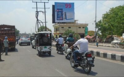 Visible Impact with hoarding Advertising companies in Lucknow | ACME Advertising Co. ACME Advertising Co. hoarding on a busy Lucknow street, exemplifying powerful outdoor branding through billboard advertising companies in Lucknow.