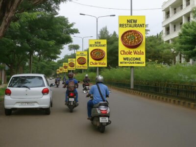 New Restaurant – Chole Wala | Family Dining Pole Kiosk advertising companies in Lucknow Banner by ACME Advertising Co. Yellow pole kiosk advertising companies in Lucknow banners by ACME Advertising Co. showing a bowl of chole and text “New Restaurant – Chole Wala – Welcome With Your Family” on urban street poles.