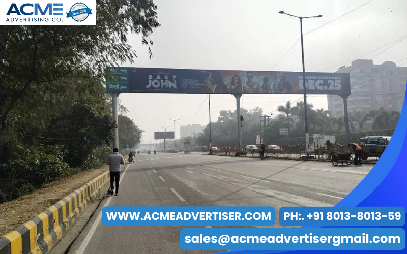 Large outdoor gantry hoarding in Ghaziabad positioned at a busy intersection.