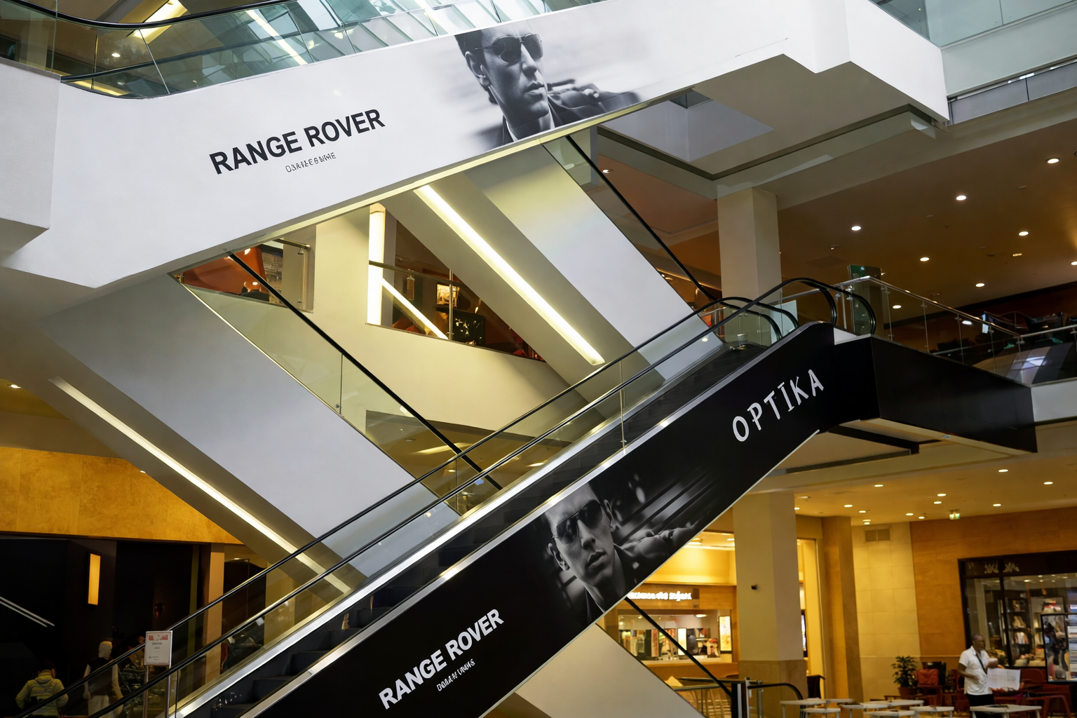 Escalator Branding Mall Advertising Display | ACME Advertising Escalator branding mall advertising display inside shopping mall by ACME Advertising
